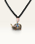 Black stone bead necklace with multicolor cloisonne elephant pendant and banded agate bead, front view on white background