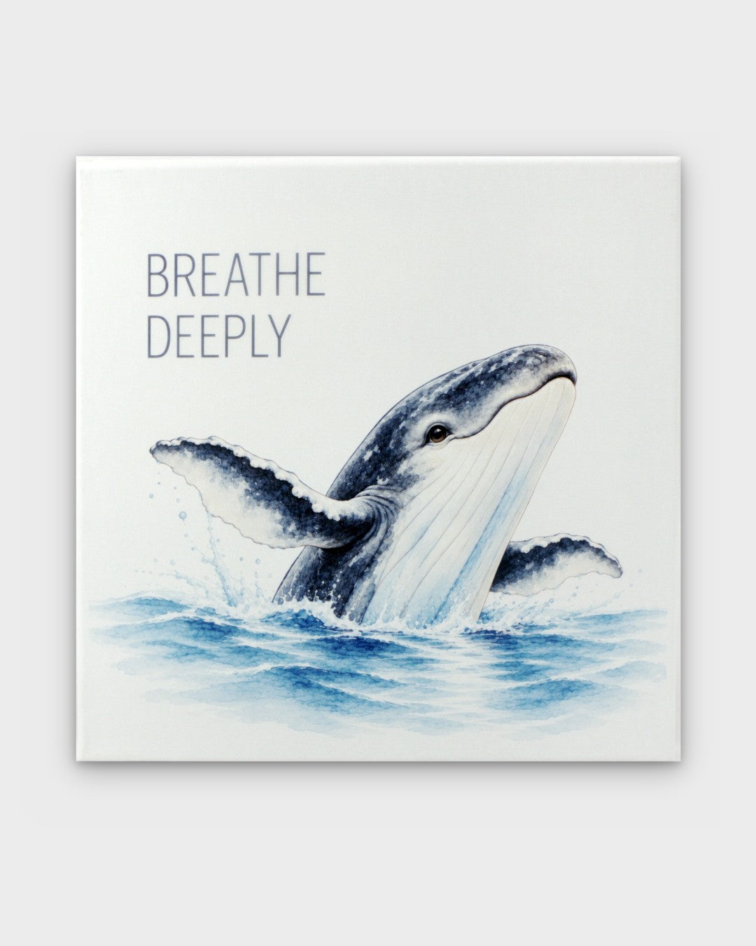 Breathe Deeply watercolor whale canvas wall art, front view showing breaching humpback whale in blue tones on white background