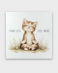 Think Less Feel More meditating cat canvas wall art, front view showing tabby cat in lotus pose among daisies