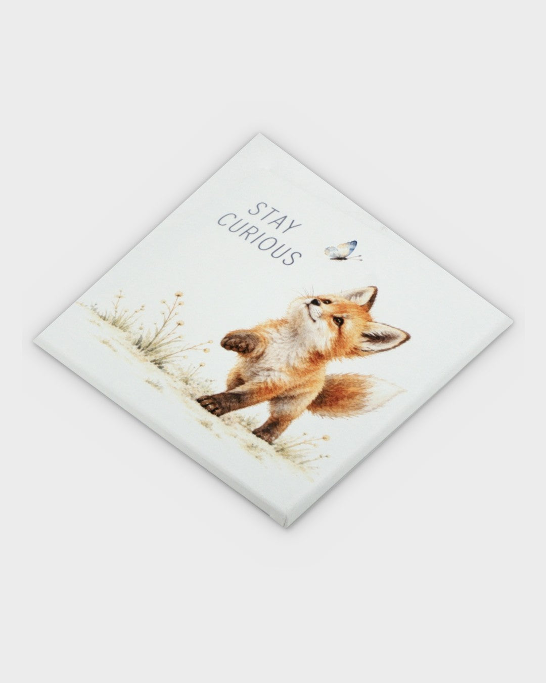 Stay Curious watercolor fox canvas wall art tilted at a diagonal angle, showing canvas thickness and printed surface
