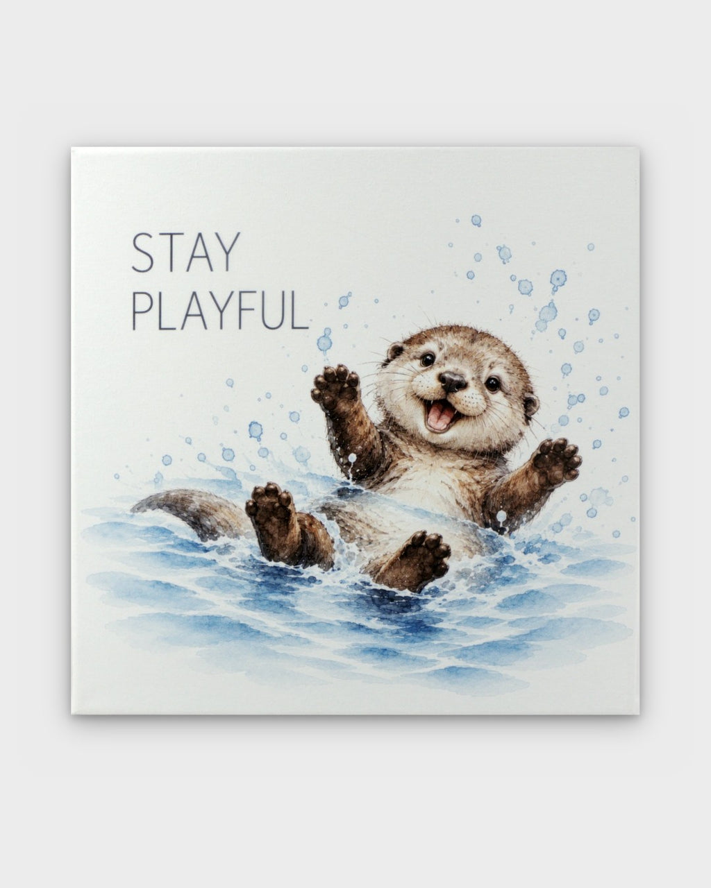 Stay Playful watercolor otter canvas wall art, front view showing splashing otter and text on white background