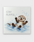 Stay Playful watercolor otter canvas wall art, front view showing splashing otter and text on white background
