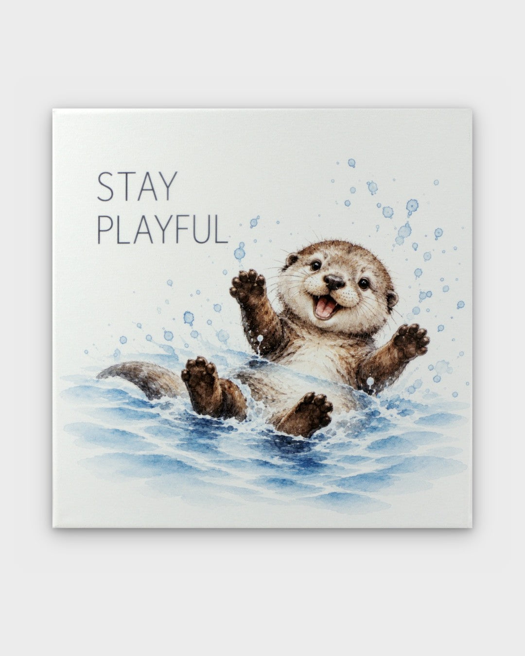 Stay Playful watercolor otter canvas wall art, front view showing splashing otter and text on white background