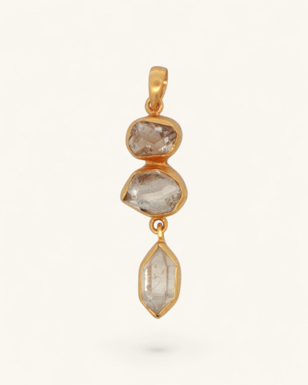 Triple Herkimer Quartz gold-plated pendant front view, three stacked crystals in organic gold bezels on white background